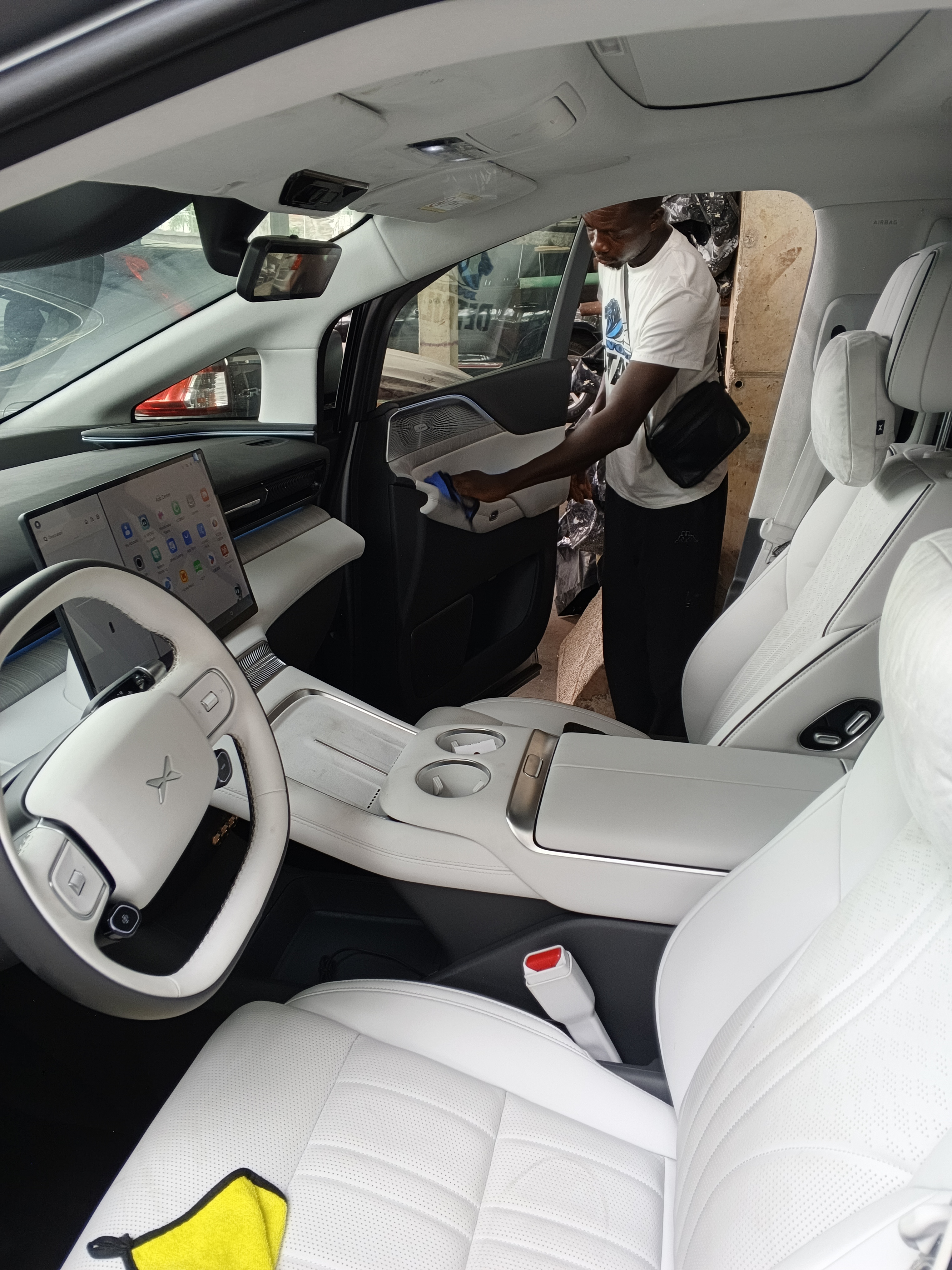 Interior detailing of a luxury car showing clean leather seats and dashboard